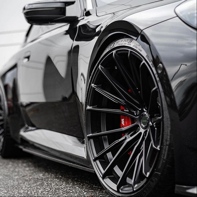 Forged performance wheel with red brake caliper